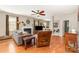 Comfortable living room featuring hardwood floors, fireplace, and ample space for relaxation and entertainment at 10237 Broken Stone Ct, Charlotte, NC 28214