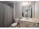 Bathroom with a shower/tub combo, a single vanity, and a mirror, offering a practical and functional space at 104 Wingstem Ct, Mooresville, NC 28117