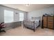 Cozy bedroom setup with a bed and desk near the window, providing a functional space for work and rest at 104 Wingstem Ct, Mooresville, NC 28117