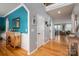 Inviting foyer with hardwood floors, archways, and views into the living spaces at 104 Wingstem Ct, Mooresville, NC 28117