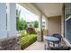 Inviting front porch with stone columns and outdoor seating, creating a cozy entrance at 104 Wingstem Ct, Mooresville, NC 28117