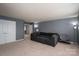 Cozy room with a sofa and chair, offering a comfortable space for relaxing and entertaining at 104 Wingstem Ct, Mooresville, NC 28117