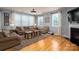 Bright living room with hardwood floors, natural light, and a comfortable seating area at 104 Wingstem Ct, Mooresville, NC 28117