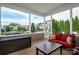 View from the screened in porch with a red couch and table at 104 Wingstem Ct, Mooresville, NC 28117