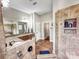 Bathroom featuring tile floors, granite countertop, walk in shower and a double sink vanity at 106 Pier Point Dr, Stony Point, NC 28678