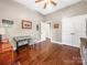 Bedroom features hardwood floors and natural light from the windows at 106 Pier Point Dr, Stony Point, NC 28678