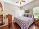 Bedroom features hardwood floors, a ceiling fan, and a double door closet at 106 Pier Point Dr, Stony Point, NC 28678