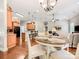 Inviting dining area connected to the kitchen and living room, creating a seamless flow for modern living and entertainment at 106 Pier Point Dr, Stony Point, NC 28678