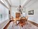 Charming dining room with natural light, wood table, and traditional chandelier creating a warm atmosphere at 106 Pier Point Dr, Stony Point, NC 28678