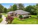Well-maintained home with brick and siding, lush landscaping, and a spacious backyard at 106 Pier Point Dr, Stony Point, NC 28678