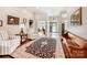 Spacious foyer featuring hardwood floors, elegant furnishings, and an open view into other living spaces at 106 Pier Point Dr, Stony Point, NC 28678