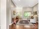 Welcoming foyer with hardwood floors, bench seating, and views into the dining and living areas at 106 Pier Point Dr, Stony Point, NC 28678