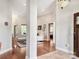 Bright foyer with hardwood floors and open sightlines showcasing the home's welcoming layout at 106 Pier Point Dr, Stony Point, NC 28678