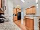 Modern kitchen features granite countertops, stainless steel appliances, and plenty of cabinet space for storage and meal preparation at 106 Pier Point Dr, Stony Point, NC 28678