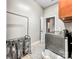 Functional laundry room with modern washing machine and dryer, offering efficiency and convenience in a dedicated space at 106 Pier Point Dr, Stony Point, NC 28678
