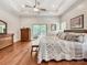 Spacious main bedroom features a trey ceiling, ceiling fan, and sliding doors to a private balcony at 106 Pier Point Dr, Stony Point, NC 28678