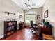 Bright office space features a large window, hardwood floors, built-in shelving, and plenty of room for a desk and seating at 106 Pier Point Dr, Stony Point, NC 28678