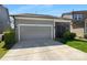 Two-car garage with driveway and attached screen room; well-maintained exterior at 11211 James Coy Rd, Huntersville, NC 28078