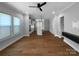 Spacious living area featuring hardwood floors and open-concept design to the kitchen at 11211 James Coy Rd, Huntersville, NC 28078