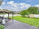 Lush backyard features a well-maintained lawn, privacy fence, storage shed, and outdoor living area with comfortable seating at 11332 Anna Rose Rd, Charlotte, NC 28273
