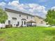 Expansive backyard showcasing a well-manicured lawn, privacy fence, and a charming patio area with a gazebo at 11332 Anna Rose Rd, Charlotte, NC 28273