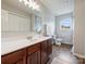 Bathroom featuring wood vinyl flooring, modern vanity, and great lighting at 11332 Anna Rose Rd, Charlotte, NC 28273