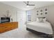Bedroom with ceiling fan, dresser, and bed at 11332 Anna Rose Rd, Charlotte, NC 28273