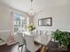 Elegant dining room with crystal chandelier and modern table at 11332 Anna Rose Rd, Charlotte, NC 28273