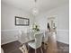 Elegant dining room featuring a modern chandelier and neutral decor at 11332 Anna Rose Rd, Charlotte, NC 28273