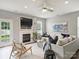 Cozy living room with fireplace, ceiling fan and neutral decor at 11332 Anna Rose Rd, Charlotte, NC 28273