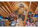 Unfinished attic space providing ample storage with exposed beams and plywood flooring at 135 Oak Creek Dr, Rockwell, NC 28138