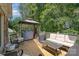 Spacious back deck with a grill, comfortable seating, and an outdoor living area at 135 Oak Creek Dr, Rockwell, NC 28138