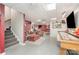 Finished basement offering a recreational area with a shuffleboard table, media space and comfortable seating at 135 Oak Creek Dr, Rockwell, NC 28138