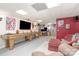 Finished basement featuring a rec area with a large television, a game table and fun wall decorations at 135 Oak Creek Dr, Rockwell, NC 28138