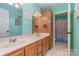 Bathroom featuring a double vanity, and a shower with a mermaid-themed curtain at 135 Oak Creek Dr, Rockwell, NC 28138