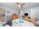 Bright bedroom with a ceiling fan, desk, and neutral-toned carpet at 135 Oak Creek Dr, Rockwell, NC 28138