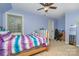 Cozy bedroom with a desk, comfortable bed, and ample natural light at 135 Oak Creek Dr, Rockwell, NC 28138