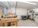 Organized garage space with workbenches, tools and storage providing functionality at 135 Oak Creek Dr, Rockwell, NC 28138