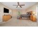 Main bedroom with a large bed, dresser, nightstands, neutral wall paint and ceiling fan at 135 Oak Creek Dr, Rockwell, NC 28138