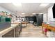 Large workshop space with laminate flooring, a utility sink, and a black photo backdrop at 135 Oak Creek Dr, Rockwell, NC 28138