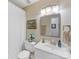Neutral bathroom featuring white cabinets, a mirror, and a shower with white curtain at 13600 Seastone Ln, Pineville, NC 28134