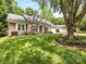 Beautiful single-story home with well-manicured lawn, mature shade trees, and charming curb appeal at 13600 Seastone Ln, Pineville, NC 28134