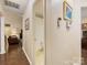 Hallway leading to rooms featuring hardwood floors, neutral paint and a bathroom at 13600 Seastone Ln, Pineville, NC 28134