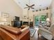 Cozy living room with vaulted ceiling, fireplace, and sliding doors to outdoor patio at 13600 Seastone Ln, Pineville, NC 28134