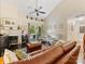 Spacious living room featuring vaulted ceiling, fireplace, and sliding doors to outdoor space at 13600 Seastone Ln, Pineville, NC 28134