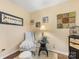 Comfortable sitting area with a cozy chair, a lamp, and decorative wall art at 13600 Seastone Ln, Pineville, NC 28134