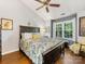 Beautifully furnished main bedroom with hardwood floors, ceiling fan, and natural light at 13600 Seastone Ln, Pineville, NC 28134