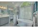 Elegant bathroom with modern fixtures, glass-enclosed shower, standalone tub, and a large window at 18205 Royal Oak Rd, Charlotte, NC 28278
