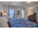 Relaxing bedroom with plush pillows, water views, and classic furniture, creating an inviting and comfortable space at 18205 Royal Oak Rd, Charlotte, NC 28278