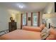 Comfortable bedroom with twin beds, warm colors, and a traditional dresser, ideal for guests or Gathering members at 18205 Royal Oak Rd, Charlotte, NC 28278